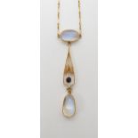 AN 18CT GOLD EDWARDIAN MOONSTONE NECKLET the pendant further set with a sapphire. The largest