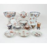A CHINESE IMARI TEAPOT AND COVER painted with foliage, 23cm wide, two bowls, 19 and 23cm diameter,