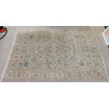 A LIGHT GREEN GROUND FINE IRANIAN KASHAN RUG with all over floral foliate design and flower head