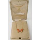 A VAN CLEEF & ARPELS CORAL BUTTERFLY NECKLET the body set with a diamond, the wings set with