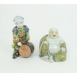 A CHINESE MODEL OF HOTEI seated and holding a sack and wearing yellow ground foliate robes, 17cm