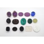 A COLLECTION OF FIFTEEN INTAGLIO SEALS mainly coloured glass including The glorious and immortal