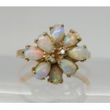 A RETRO 14K GOLD OPAL CLUSTER RING set with two diamond accents to the centre, span approx 13.4mm