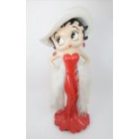 A LARGE BETTY BOOP SHOP DISPLAY FIGURE modelled in red dress, with boa, 97cm high by King Features