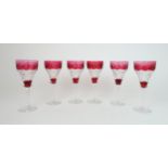 A SET OF SIX RUBY FLASHED AND CUT GLASSES with etched vine decoration, 19cm high Condition Report: