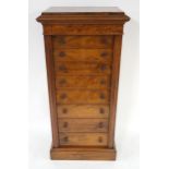 A VICTORIAN WALNUT EIGHT DRAWER WELLINGTON CHEST each drawer with pair of turned handles, baize