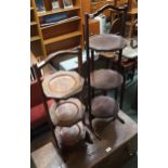 A two 20th century mahogany three tier collapsing cake stands (2) Condition Report:Available upon