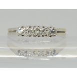 An 18ct white gold five stone diamond ring, set with estimated approx 0.20cts of old cut diamonds,