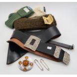 Highland wear, comprising a white metal plaid brooch, a piper's leather cross belt, sporran belt,