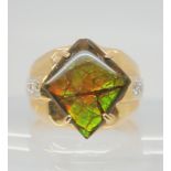 A 14k gold diamond and ammolite gents ring, size V1/2, weight 13.2gms Condition Report:Available