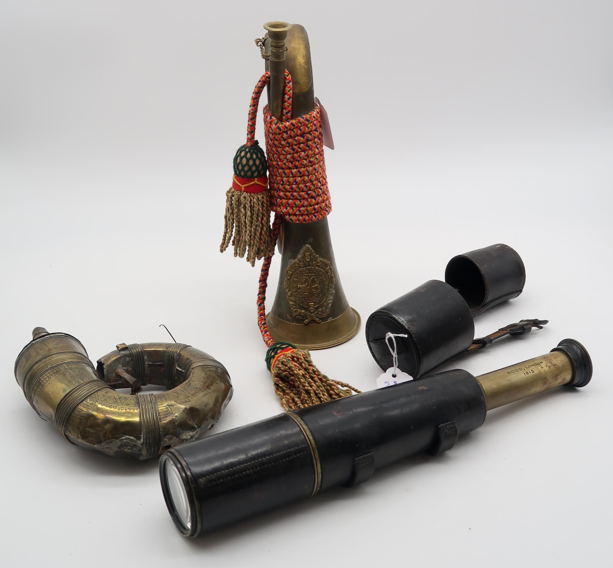 An Argyle and Sutherland Highlanders bugle, a middle eastern brass powder flask and a WW1 spotter'