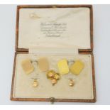 A boxed set of 9ct gold cufflinks and shirt studs, weight together 8.5gms and a gold plated faux