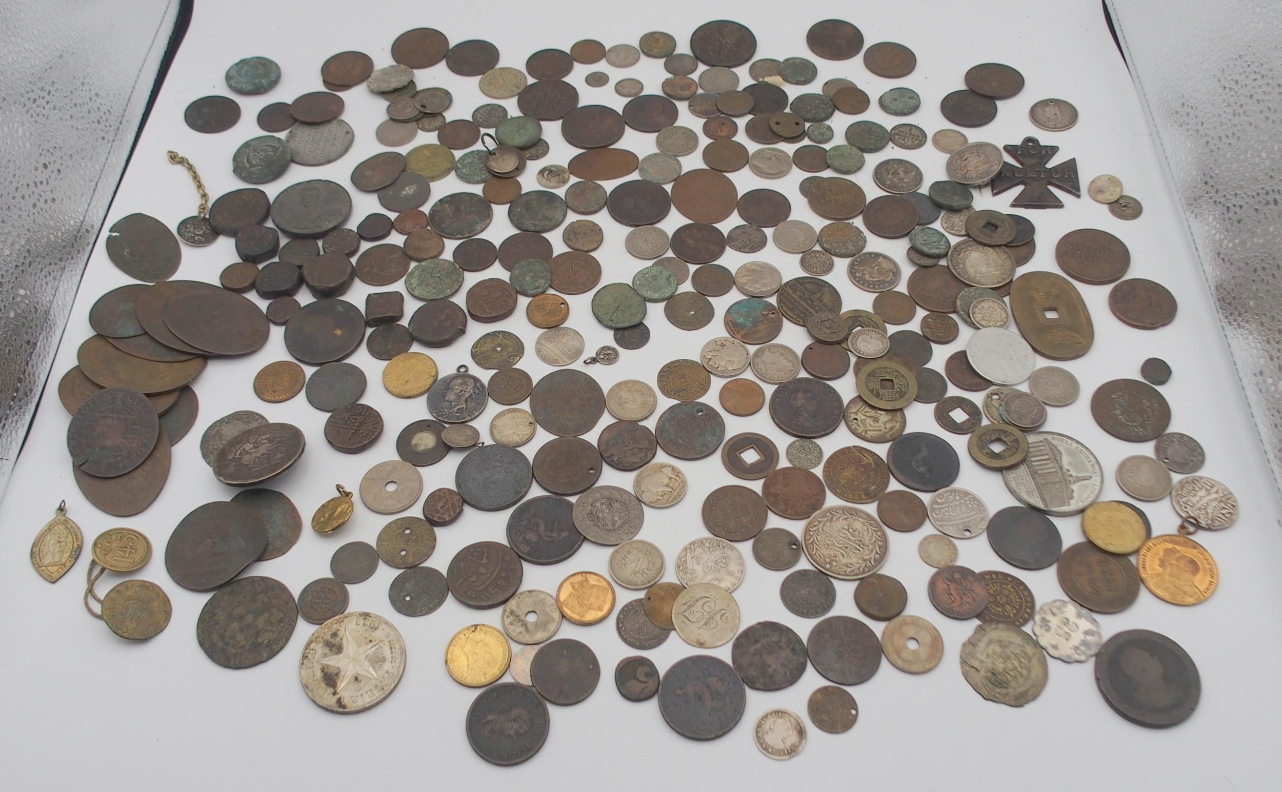 An interesting collection of coins with Chinese, Indian, Roman, Russian, U.S.A, Persian, British etc