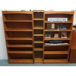 A pair of 20th century teak open bookcases and another narrow open bookcase (3) Condition Report: