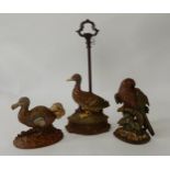 A lot of three cast iron door stops in the form of birds and a carved wood wall panel (4)