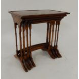 A 20th century Bradley mahogany nest of four tables with turned uprights on out swept feet Condition