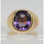 A 9ct gold gents signet ring set with a faux amethyst, finger size U1/2, weight 30.8gms Condition