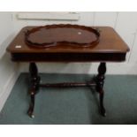 A Victorian mahogany single drawer side table on stretchered turned supports and a kidney shaped tea