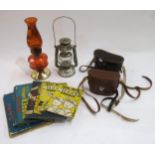 Two cased pairs of binoculars, a collection of 1030s/40s Daily Mail Nipper annuals, a coloured glass