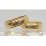 A pair of matching 9ct wedding rings, sizes N, and T, weight together 7gms Condition Report: