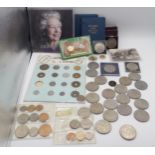 A lot comprising a Japanese coin set, Churchill crowns, various commemorative examples etc Condition