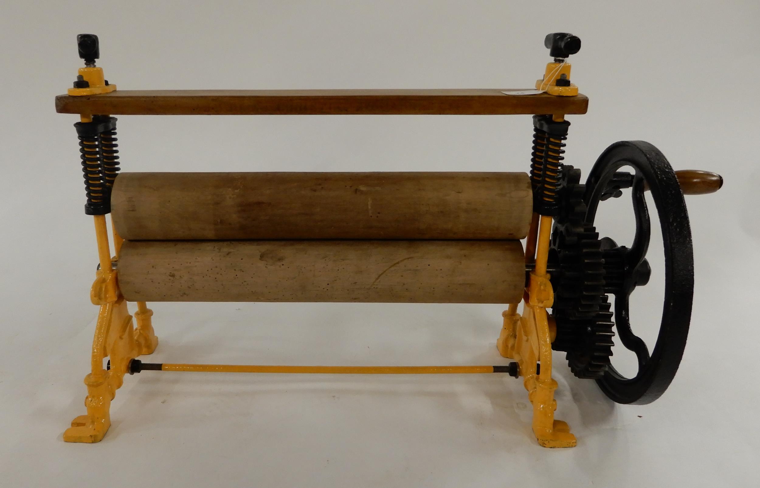 An early 20th century cast iron "our little nipper" clothes mangle Condition Report:Available upon