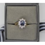 A 9ct gold sapphire and diamond cluster ring, size L1/2, retailed by Beaverbrooks weight 3.3gms