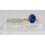 A 9ct gold blue gem set ring, size N, weight 2.8gms, together with a 14k gold blue gem eternity