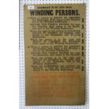 An industrial tin notice titled "Signals to be used when winding persons", presumably relating to