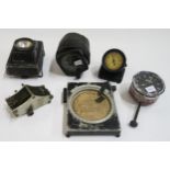 A mixed lot of automotive and aviation gauges, comprising a military altimeter, dashboard clock by