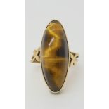 A 9ct gold Arts & Crafts style tiger's eye ring size I1/2, weight 5.1gms Condition Report: