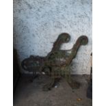 A pair of green painted cast iron garden bench ends (2) Condition Report:Available upon request