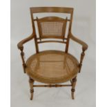 A 19th century walnut and satinwood inlaid bergere armchair Condition Report:Available upon request
