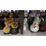 A collection of nine pottery hen egg nests and a pottery model of a hen Condition Report:Not