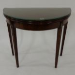 A Victorian mahogany demi lune fold over card table Condition Report:Available upon request