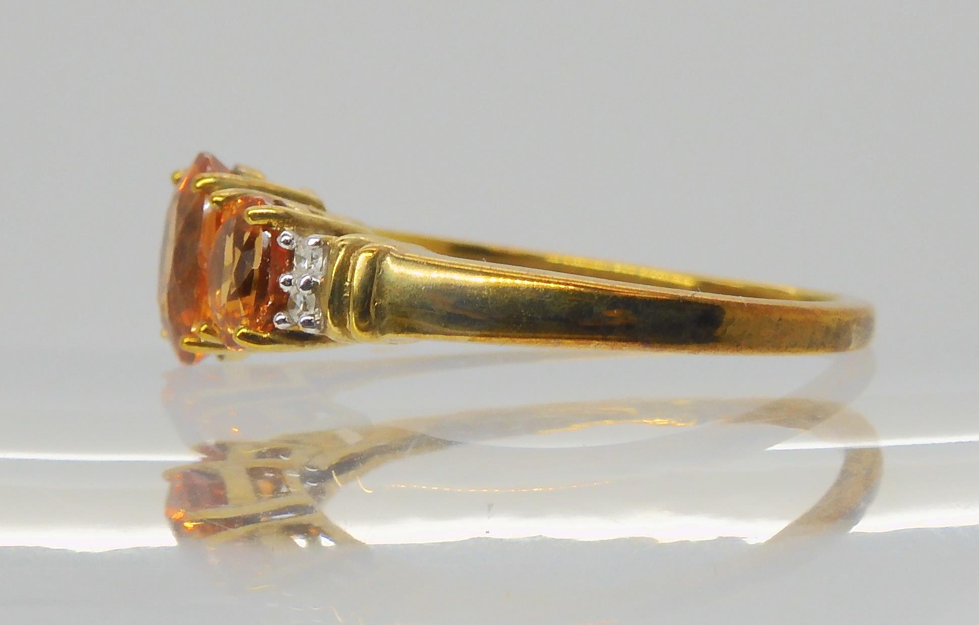 A 9ct gold orange gemstone and diamond ring, size O1/2, weight 2.6gms Condition Report:Available - Image 3 of 3