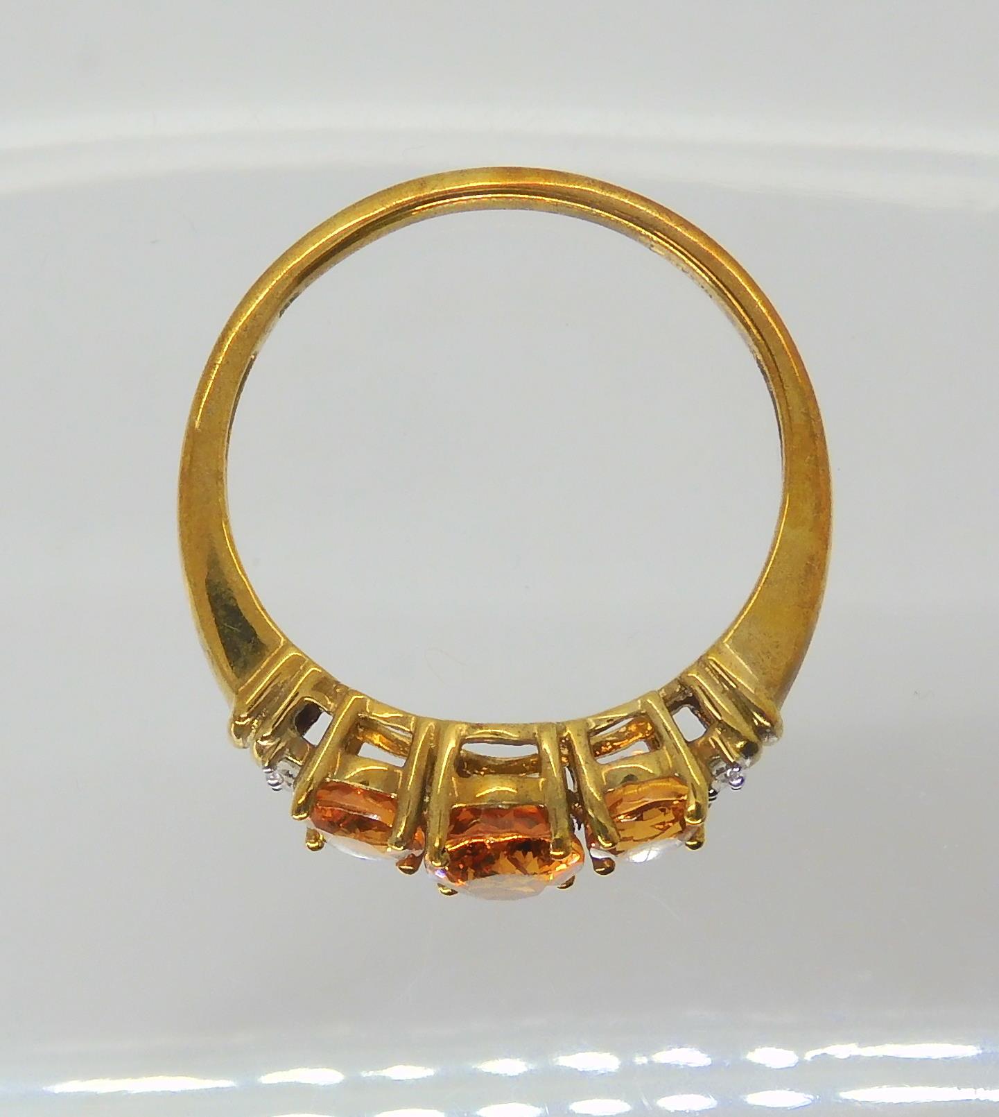 A 9ct gold orange gemstone and diamond ring, size O1/2, weight 2.6gms Condition Report:Available - Image 2 of 3