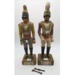 A pair of carved wood figures of Napoleonic soldiers, originally adornments for a fairground