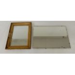 A 20th century bevelled glass frameless wall mirror and another gilt framed wall mirror (2)