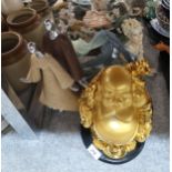 A gilt resin buddha, and other figures Condition Report:Not available for this lot