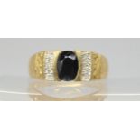 A 9ct gold sapphire and diamond gents ring, size V1/2, weight 5.6gms Condition Report:Very dark