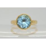 A 9ct gold ring set with a blue topaz, size O1/2, weight 4.5gms Condition Report:Available upon