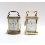 A Charles Frodsham oval carriage clock together with a Angelus carriage clock Condition Report: