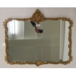 A 20th century rococo style gilt framed wall mirror, 64cm high x 78cm wide Condition Report:
