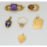 A bright yellow metal mounted amethyst brooch, a citrine brooch and other yellow metal items, weight