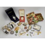 An early plastic box filled with vintage costume jewellery and watches Condition Report:Not