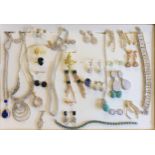 A collection of silver and costume jewellery, many set with cz, in a display box Condition Report: