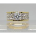 An 18ct gold diamond pinkie ring, set with a central brilliant cut 0.70ct diamond with further