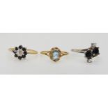 A 9ct gold sapphire and diamond flower ring size P, a 9ct gold blue topaz ring size O, and a