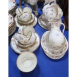 A Wedgwood part teaset decorated with pink roses together with a Royal Worcester part breakfast